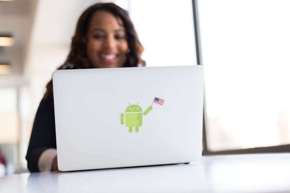 Ananya Gupta smiling while studying at her laptop