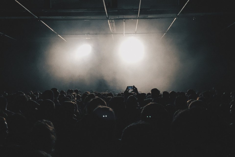 Stage lights over a live audience